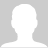 White silhouette of a human head and shoulders on a solid gray background with no visible facial features or clothing details.