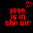 Red pixelated text 'love is in the air' on black background with red heart symbol above, two identical static frames side-by-side.