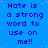 Blue background with repeated pixelated text 'Hate is a strong word to use on me!!' in dark blue, scattered pink dots, and a solid gray rectangle at bottom right.