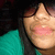 A person wearing a teal shirt and dark sunglasses with lips slightly parted in the top-left view, then smiling broadly in the top-right view, and finally closing eyes while still smiling in the bottom-left view.
