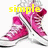 Pink high-top sneakers with white laces and soles, displayed in a with yellow text overlays