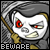 A pixelated character with red eyes and a scythe, wearing a hooded cloak, with the word BEWARE below.