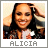 Pixelated portrait of a smiling person with long dark hair, wearing a dark jacket over a light shirt, with text 'ALICIA' below.