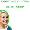Green pixelated text reads 'keep your mind wide open' above a cropped image of a smiling person with blonde hair and a blue-and-white top.