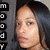 A static pixelated image shows a person with dark hair and light skin, partially visible against a gray background with vertical text.