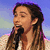 A pixelated image shows a person with long brown hair holding a microphone against a blue sky background, next to text reading "Jason's my daydream" on purple.