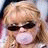 A pixelated image of a person with blonde hair and sunglasses blowing bubble gum, next to blue background text reading 'hilary duff'.