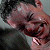 Static image of a person's face on left, green background with pixelated text 'Original Icons .com' on right.