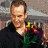 A man in various poses holding objects, including a bouquet of flowers and white spherical items, against different backgrounds.