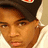 Pixelated image of a person wearing a dark cap and light shirt with pink text reading 'i love bow wow' on a light background.