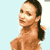 Pixelated static image of a person with dark hair in a ponytail against light blue background, no visible clothing or text.