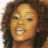 Static 48x48 pixel buddy icon showing a close-up of a person's face with dark curly hair and warm skin tones, rendered in low-resolution pixel art style.