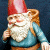 A pixelated garden gnome icon with a red hat and blue shirt on the left, next to green text reading "Original Icons .com" on a dark background.