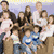 A pixelated group photo of adults and children with overlaid text reading "Jon and Kate plus Eight" in orange font, surrounded by colorful circles.