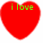 Two red heart shapes side-by-side with green pixelated text; left reads 'i love', right reads 'MEGAN' on white background.