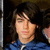 A person with long dark hair and a blue hoodie appears in two , one showing text overlay 'kim and joe' on the right side