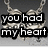 A pixelated animation of a broken heart necklace with text overlays changing across frames.