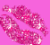 Animated contact sheet of three pink lip kiss icons with glitter effects on a gray background, showing sequential frame changes in text and sparkle intensity.