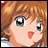 A 48x48 pixel animated buddy icon featuring a close-up of an anime-style character with orange hair and green eyes on the left, paired with stylized text reading "Anime IM" and "com" on a black background to the right.