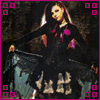 A woman in a black dress with purple accents poses against a dark background, framed by pink border squares.