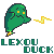 Green pixelated character with yellow eyes and mouth, emitting a yellow zigzag beam from its right side, standing above pixelated text reading LEXOU DUCK on gray background