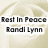 A static image of a light beige rose with text overlay reading "Rest In Peace Randi Lynn" in bold black letters.