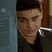 A pixelated image of a person with dark hair and a dark shirt, with a blue vertical bar on the left and red text at the bottom.