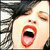 A split-screen view of a person with dark hair and red lips, mouth open in an exaggerated expression on the left side.
