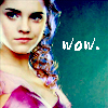 A pixelated close-up of a person with light skin and dark eyes wearing a pink garment, with the word 'wow.' in white pixelated text on a teal background.