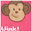 Animated monkey face with brown fur and pink background, winking one eye while smiling.