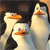 Three cartoon penguins with orange beaks and black eyes stand closely together against a dark background with brown and black tones.