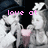 Pixelated image of a character with long white hair and pink chest area, overlaid with pink text reading 'love at first sight' against dark background.