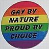 Circular rainbow-colored icon with black text reading "GAY BY NATURE PROUD BY CHOICE" across horizontal stripes.