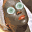A person with a gray face mask and cucumber slices over eyes, wearing a white headscarf, in six showing subtle facial expression changes