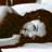 Static 48x48 pixel icon showing a low-resolution grayscale image of a person's face with dark hair and light skin tones, partially obscured by motion blur or compression artifacts.