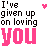 Pixelated text reads "I've given up on loving YOU" with pink hearts appearing and disappearing near the top-right corner.
