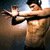 A pixelated image of a shirtless man with headphones extending his arms, accompanied by text elements on black and gray backgrounds.