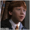 A sequence of showing a person with red hair in school attire, transitioning through various facial expressions and head positions against a bookshelf background