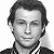 A black-and-white mugshot-style portrait of a man with dark hair and a collared shirt, surrounded by green text elements on a gray striped background.