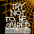 Pixelated text 'TRY NOT TO BE SHRED' in white block letters over orange and black pixelated background with horizontal striped base.