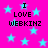 Bright pink background with scattered light blue stars and repeated black pixelated text reading "I LOVE WEBKINZ" in four quadrants.