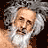 Pixelated portrait of a person with light skin, white hair, and a long white beard against dark background.