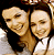 Two side-by-side pixelated images of two smiling women with dark hair, each labeled 'Gilmore Girls' text below and a pink heart symbol to the right.
