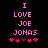 Pixelated pink text on black background reads "I LOVE JOE JONAS" with five hearts below, two of which are dark purple.