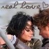 A static image shows two people in close proximity with text reading 'real love' and a heart symbol above them.