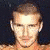 A 50x50 pixel animated buddy icon featuring a shirtless male figure with short hair and facial stubble, shown in three sequential frames where the right hand moves from resting at the side to forming a fist near the chest.