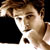 Static pixelated image of a person's face with brown hair and light skin tone, cropped closely to show upper head and shoulders against dark background.