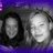 Two grayscale figures with dark hair against a purple background, alongside three green pixelated text elements on white.