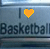A pixelated graphic shows "I" with a heart symbol and "Basketball" text, transitioning from yellow to dark green heart.