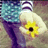 Pixelated image of a hand holding a yellow flower with blue shorts and striped socks, alongside text reading '#5 <3 u make dreams come true <3' and 'made by Taylor'.
